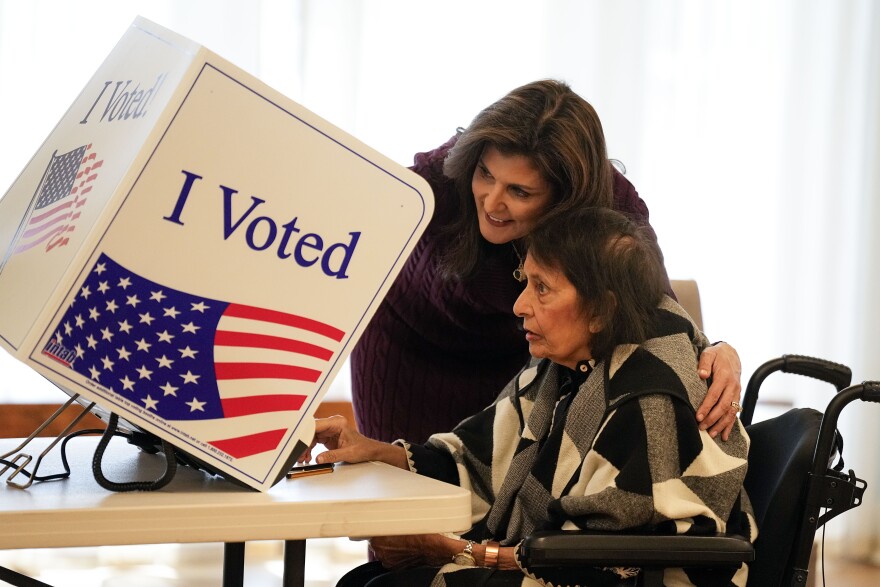 Republican presidential candidate former UN Ambassador Nikki Haley helps her mother Raj Kaur Randhawa to the voting booth Saturday, Feb. 24, 2024, in Kiawah Island, S.C.