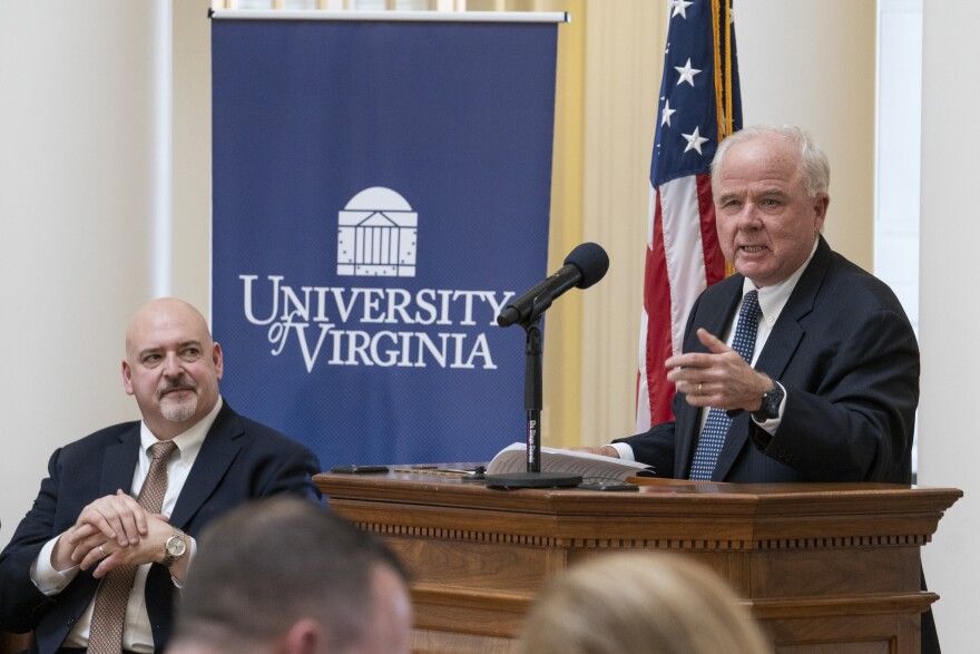 Delegate Todd Gilbert looks on as donor Paul Manning talks about the need for a new biotech research center at UVA.