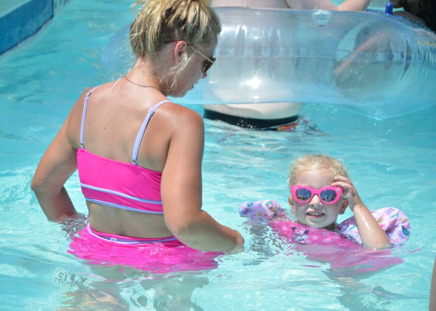 Four-year-old Lynna Buckley makes sure she and her mother, Charley Deverger, are wearing matching pink swimsuits when they head to The Springs Aquatic Center.