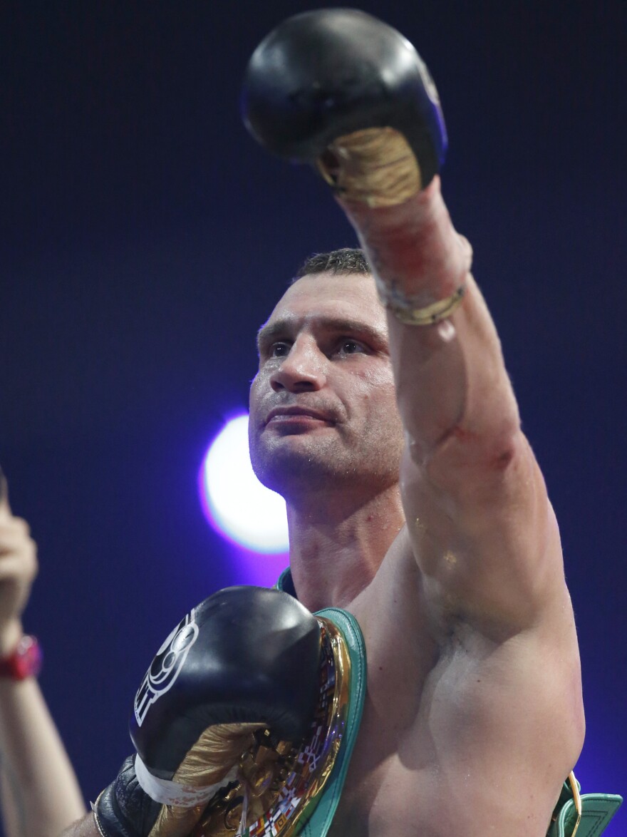 Klitschko celebrates his win over Manuel Charr of Germany during their WBC bout for the heavyweight title in Moscow on Sept. 9, 2012.