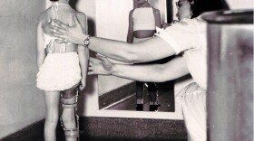 Kathy Parrish, a polio survivor, gets a check-up at Seattle Children's Hospital. Health officials are puzzled at why vaccination rates have declined in the last 17 years.