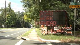 Although majority of the work has been completed, construction signs along NW 8th Ave will remain until the entire project is finished in December. (Sydney Martin/ WUFT News)