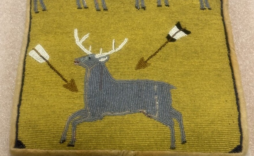 Beaded bag with deer and arrows. 