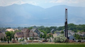 Just off Interstate Highway 25, Drill Rig 1548 of Encana Natural Gas stands near homes in the town of Frederick in Weld County, Colorado.