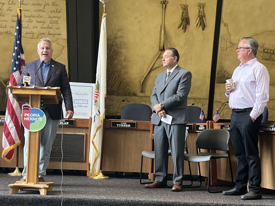 17th District Democratic Congressman Eric Sorensen (left) speaks at an event highlighting federal funding for a Peoria Heights water infrastructure project, as Director of Community Development Wayne Aldrich (middle) and Mayor Mike Phelan (left) listen.