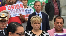 Democratic gubernatorial candidate Ned Lamont stands behind Lori J. Pelletier at a union rally in 2018.