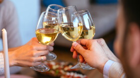 Friends clinking with glasses of wine