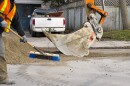Backhoe and gravel used to upgrade road surface