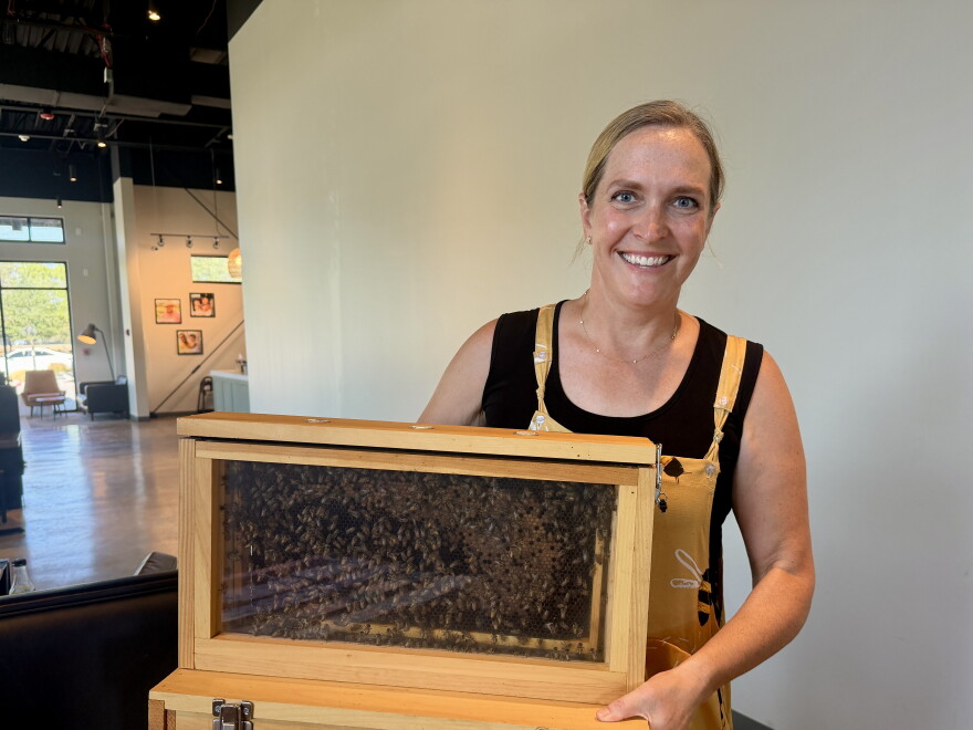 Author Shanna Upchurch shows off some of her bees as part of her appearance at Brittany's Favorite Things in Melissa.