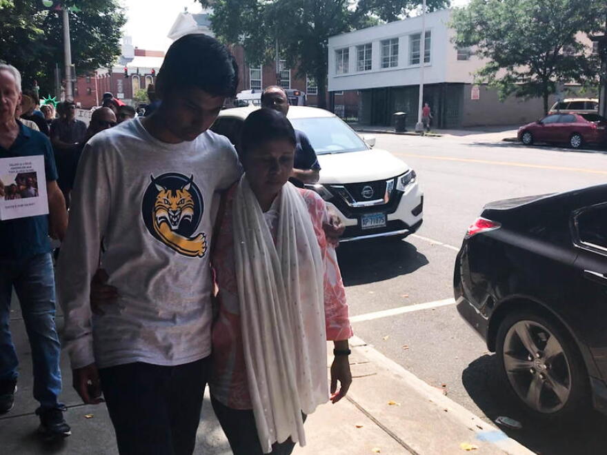 Samir Mahmud supports his mother Salma Sikander as she leaves her final immigration check-in before a deportation scheduled for Thursday, August 23.