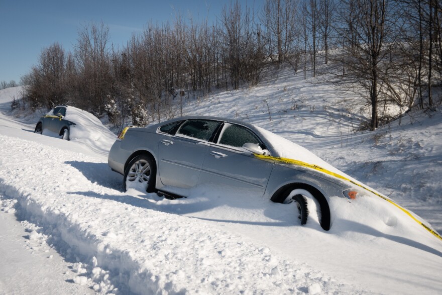 Two cars remain stranded near the off ramp from Hwy. 291 at Lakewood Boulevard in Lee's Summit on Monday, Jan. 6, 2025.