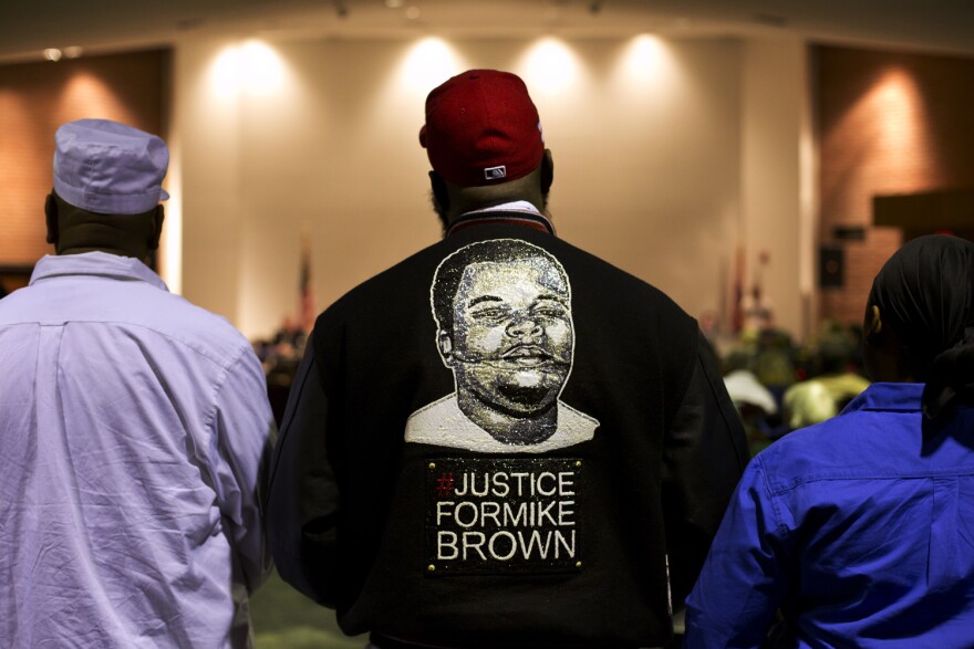 Michael Brown Sr. stands at the back of the Ferguson Community Center's event space during the public comment portion of a 2016 Ferguson city council meeting.