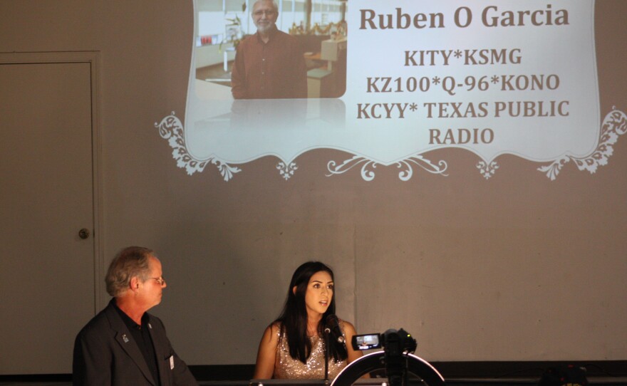 Amanda Garcia, daughter of the late Ruben O. Garcia, accepts his award from the Society of San Antonio Radio Broadcasters.