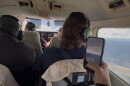 Four people in a plane.