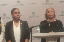 Mayor Vi Lyles (right) speaks during a news conference about an investigation into comments made by City Council member Victoria Watlington (left).