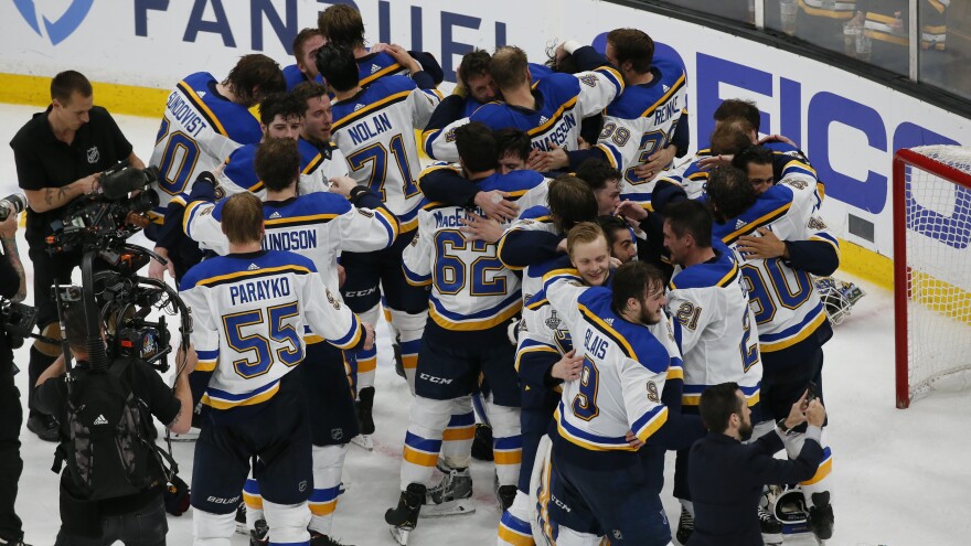 The St. Louis Blues celebrate their victory.