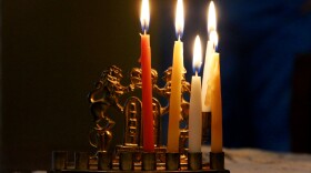 (Photo by Joy Bonala) Four candles are lit from right to left on a hanukiah Wednesday, December 9, 2015 at the apartment of Rachel Ross. 