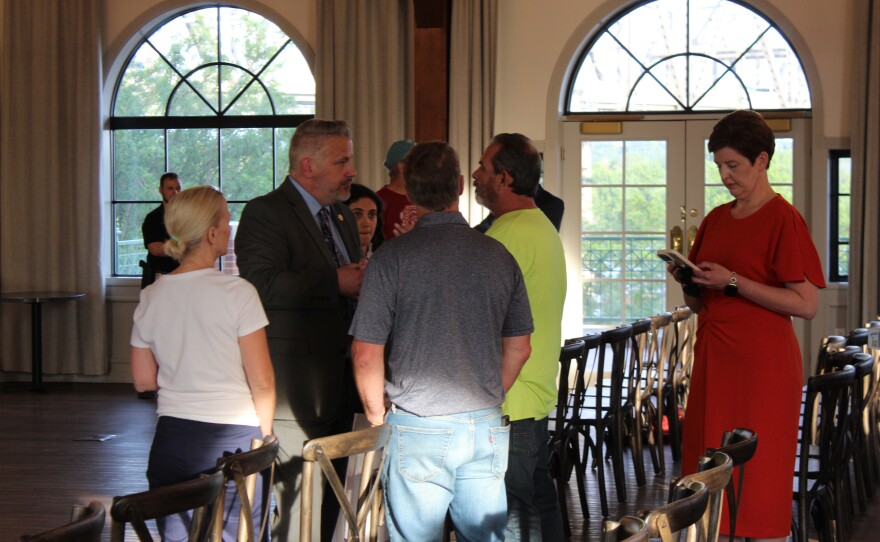 Eric Sorensen talks with constituents after the Peoria town hall.