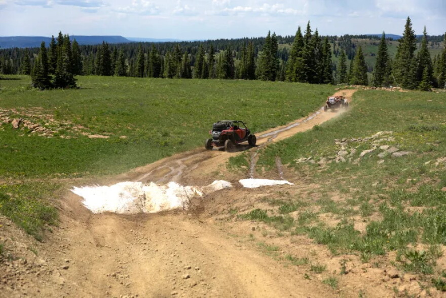 An adaptive drivers navigate the off-road vehicles in the Flat Tops mountain range, July 24, 2023, near New Castle.