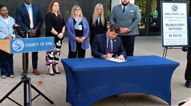 Erie County Executive Mark Poloncarz signs the county's new biometric privacy law into effect during a ceremony outside the Rath Building, Tuesday, May 26, 2026.