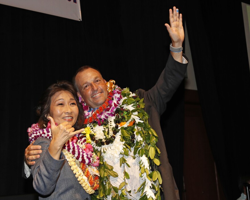 Hawaii Gov.-elect Josh Green, right, and Lt. Gov.-elect Sylvia Luke wave to supporters at the Democratic Party headquarters, Tuesday, Nov. 8, 2022, in Honolulu. (AP Photo/Marco Garcia)