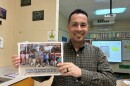 Jonathan Lancho holds up a photo of students dressed up as him for dress like a teacher day 