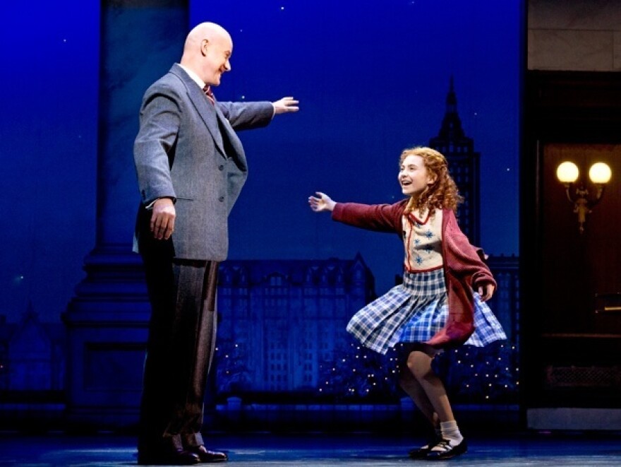 Anthony Warlow as Oliver Warbucks and Lilla Crawford as Annie in the recent Broadway revival of <em>Annie</em>. The show is almost a version of <em>Oliver!</em> in drag, Mondello said in his first-ever commentary for <em>All Things Considered.</em>