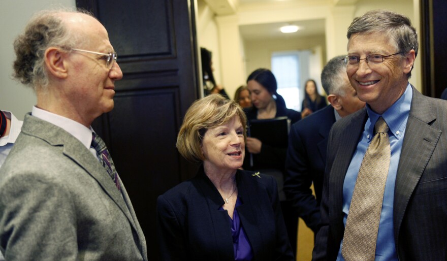 Bill Gates speaks in 2011 in New York with descendants of key figures in the fight against polio — Peter Salk, left, and Cathy Hively, granddaughter of Basil O'Connor, who helped to battle the disease through the March of Dimes.