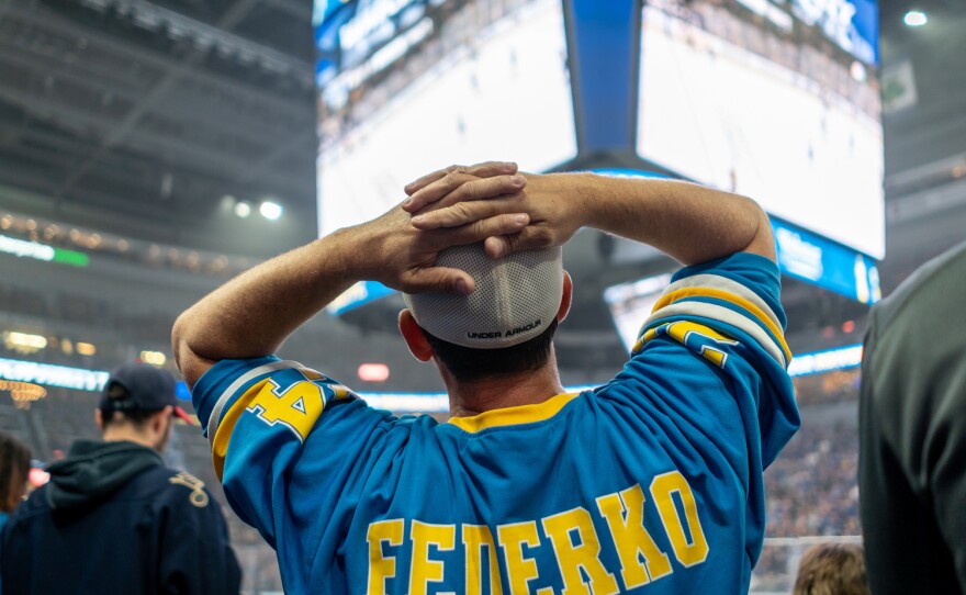 A fan watches the video board at Enterprise Center during Game 7 while wearing a jersey sporting the name of St. Louis Blues great Bernie Federko, who played 13 seasons for the team. June 12, 2019