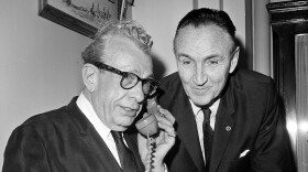 Senator Everett Dirksen (R-Ill.), Senate Minority leader, left, and Majority leader Mike Mansfield (D-Mont.) telephone from the Capitol to President Johnson in the White House that Congress has finished its pending legislation and is ready to adjourn, early Oct. 23, 1965. The president sent his thanks to the leaders and all members of the Congress, and the Senate adjourned sine die (without scheduling a future session) at 12:51 a.m., EDT, followed by the House one minute later. (AP Photo/Henry Griffin)