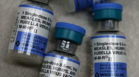 In this photo illustration, vials of measles, mumps and rubella vaccine are displayed on a counter at a Walgreens Pharmacy in Mill Valley, California.