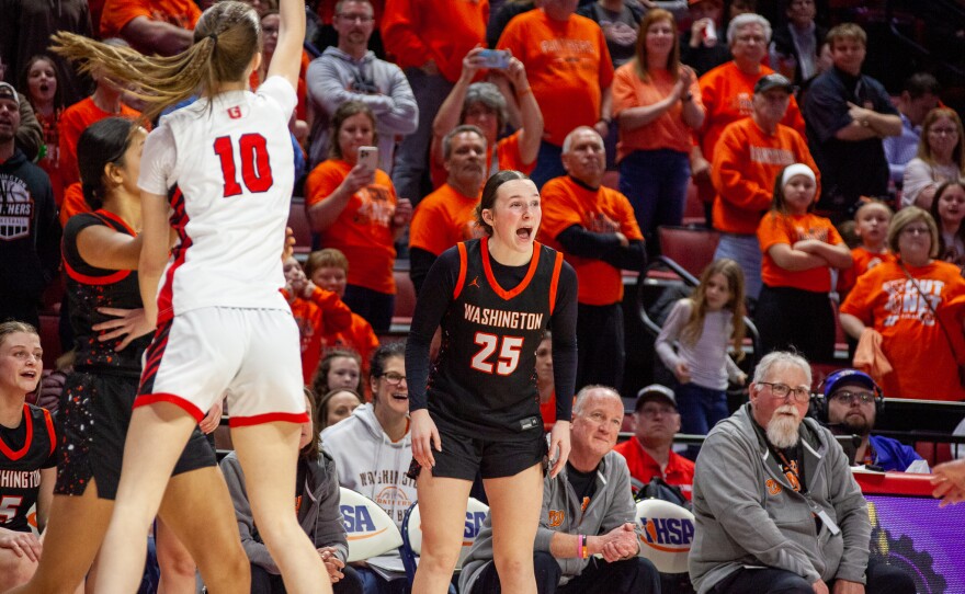 Girls high school basketball players inside an arena