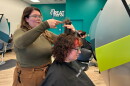 Teya Heller styles a customer's hair at Great Clips in Dickson City.