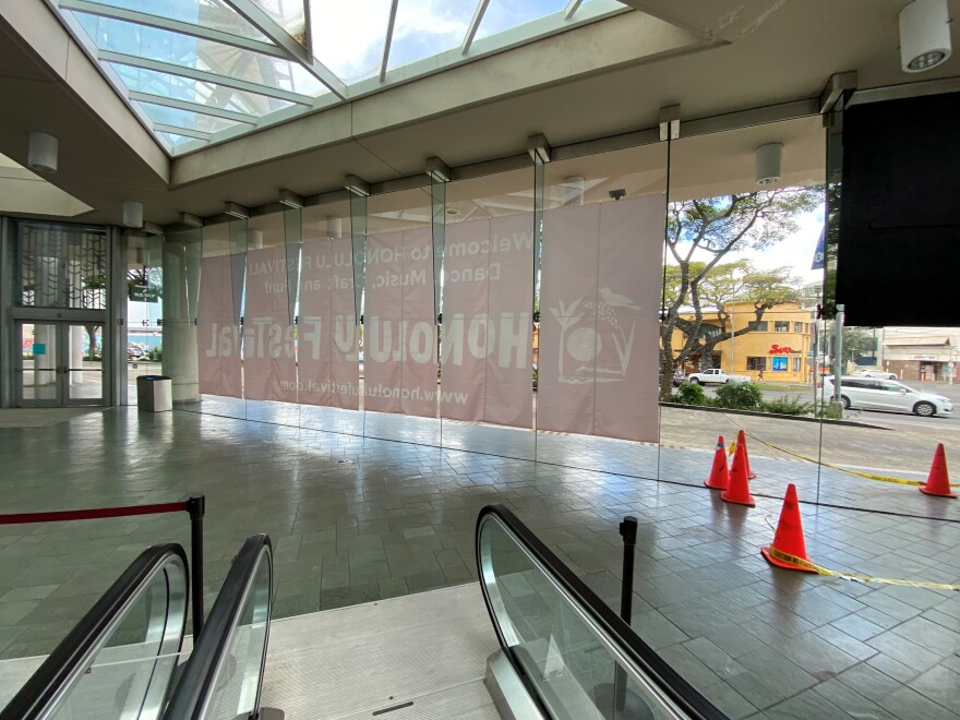 A sign for Honolulu Festival is hung inside the Hawaiʻi Convention Center. Even with the state's strict signage laws, Orton said they are allowed to promote any show or event in their building as long as they are not selling advertisements.