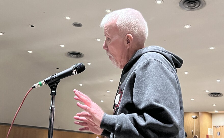 Former Hibbing School Board member Bob Clover shares concerns about sixth graders moving into Hibbing High School at a March 26, 2026, public hearing at Lincoln Middle School in Hibbing.