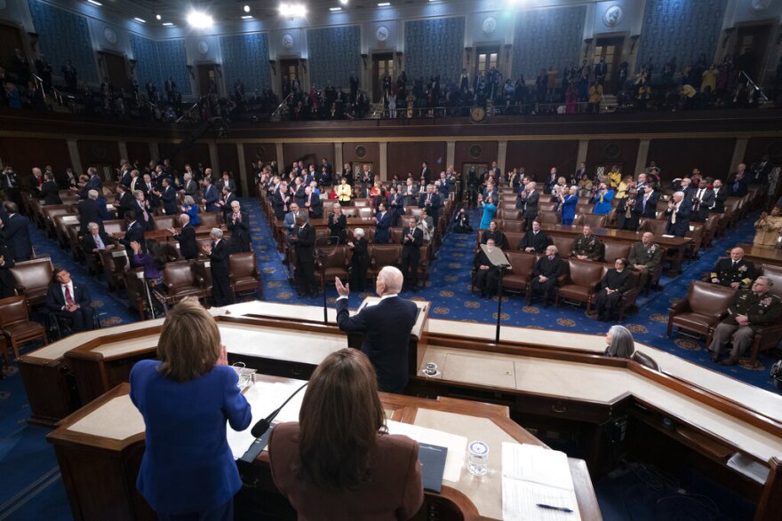 President Joe Biden delivers his first State of the Union address to a joint session of Congress at the Capitol, Tuesday, March 1, 2022, in Washington, as House speaker Nancy Pelosi of Calif., and Vice President Kamala Harris, applaud. (Shawn Thew/Pool via AP)