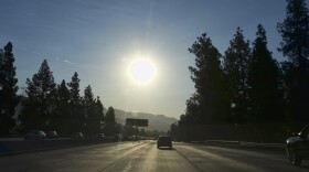 A strong morning sun rises over the Ventura Freeway State Route 134 in Burbank, Calif. on Friday, July 6, 2018. Forecasters say temperatures will soar into triple digits throughout almost all of Southern California as a brief but intense heat wave broils the region. (Richard Vogel/AP)