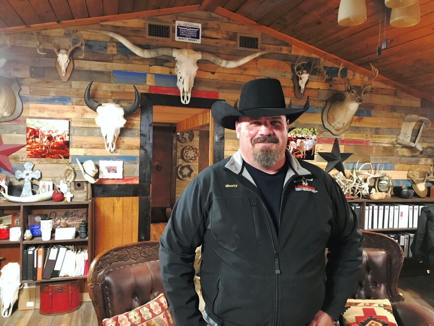 Monty Awbrey, pictured here in his home office, is a businessman and supporter of President Trump's proposed border wall.