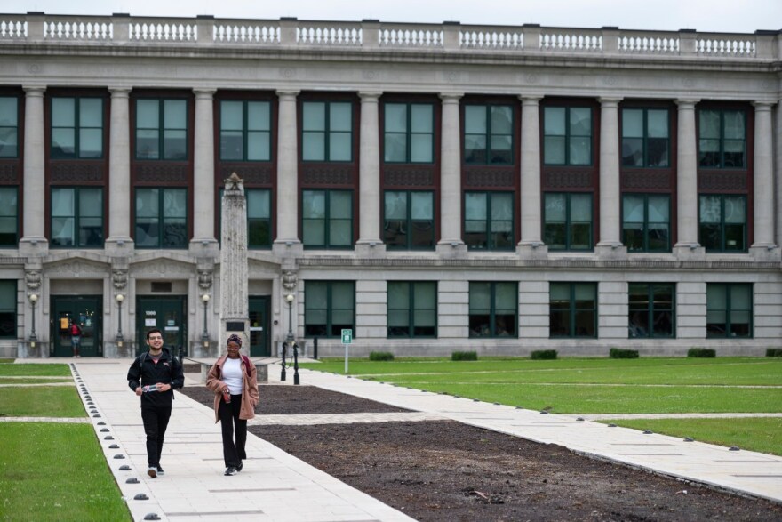 Edward Montoya and Serena Smith walk through the Houston Community College Central Campus in Houston on April 26, 2022.