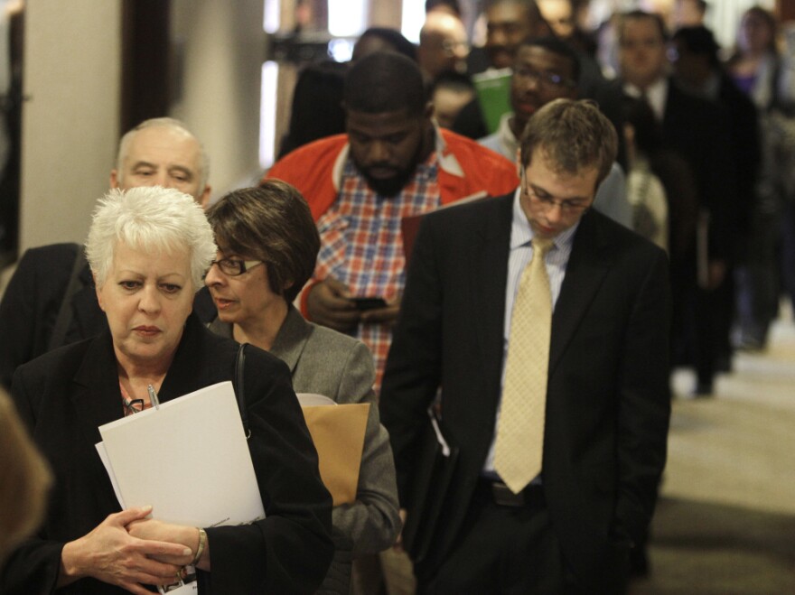 Mary Polocy (left) stands in line to enter a career fair in Independence, Ohio, in November. Congress has yet to agree on a measure that would extend unemployment benefits.