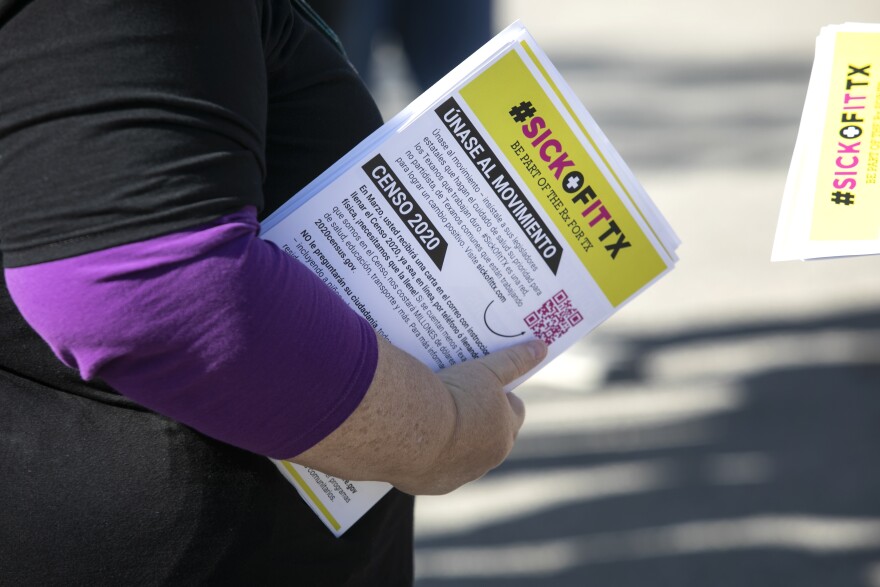 A group of health care advocates knock on doors on Nov. 9, 2019, in an effort to rally support to demand lawmakers address the high rate of uninsured people in Texas. 