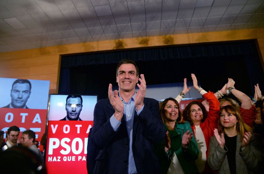 Spanish Prime Minister Pedro Sánchez applauds after presenting his campaign poster during a rally to officially launch the Spanish Socialist Party's electoral campaign in Seville on April 11. General elections are on Sunday.