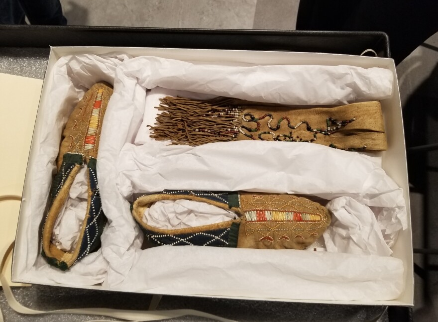 The 17th century moccasins and wampum bag.