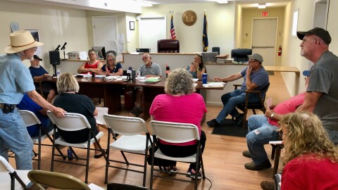 Town of Cameron board of supervisors hears public comment from resident Wayne Wells (standing left) on the banning of sewage sludge as fertilizer in its jurisdiction at the board meeting on July 10, 2024.