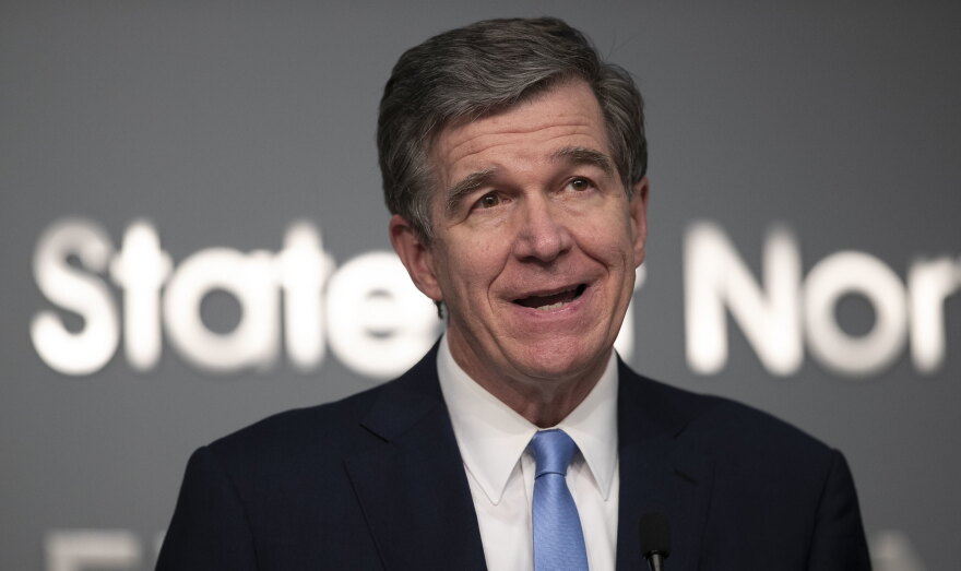 North Carolina Gov. Roy Cooper, seen here during a June 18, 2020, press briefing, said Wednesday he needs more time to decide on a plan for how public schools will operate in the fall during the coronavirus pandemic. 