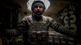 A Ukrainian artilleryman from the 24th brigade stands inside of a 2S1 Gvozdika self-propelled howitzer at a position along the front line in the vicinity of Bakhmut, Donetsk region.