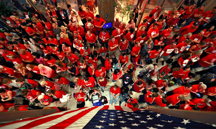 Teachers crowd the lobby of the Arizona Senate as Arizona legislature debate a budget negotiated by majority Republicans and GOP Gov. Doug Ducey Thursday, May 3, 2018, at the Capitol in Phoenix.