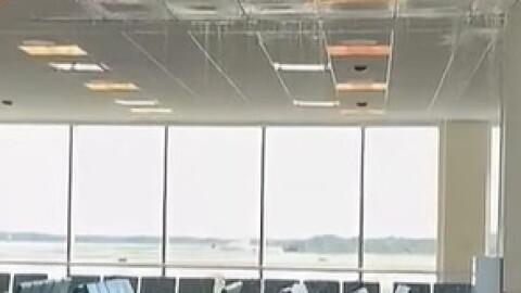 Water cascades from the ceiling in Terminal D at RSW Saturday after a bolt on a chilled water line broke. An airport official said Sunday that the line was quickly fixed and cleanup nearly completed.