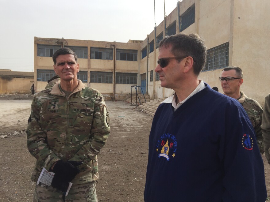 CENTCOM commander Joseph Votel (left) stands with USAID Administrator Mark Green during a media tour of Raqqa, Syria, on Monday.