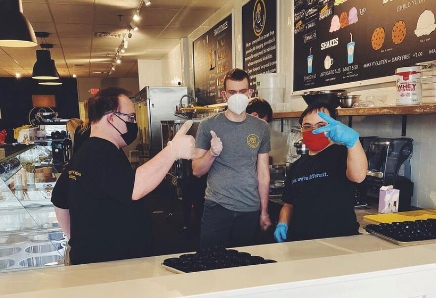 Three employees or 'Super Scoopers' pose at The Golden Scoop ice cream parlor at 95th street and Nall in Overland Park.